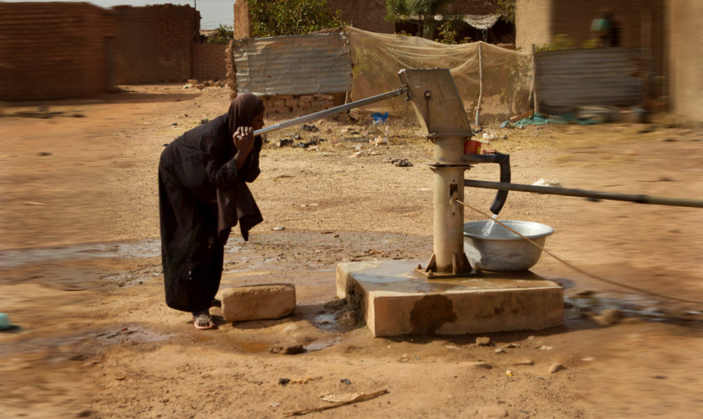 Woman using a well